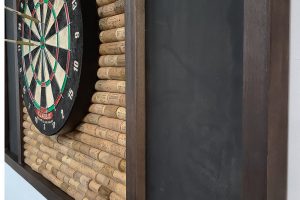 Dart backboard with wine cork close up side view comp